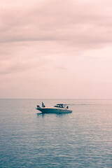 Yacht on the Caribbean Sea during sunset in Jamaica.