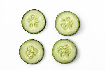 Four slices of cucumber for fresh vegetables, isolated on white background, copy space