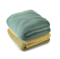 Soft folded blankets on white background