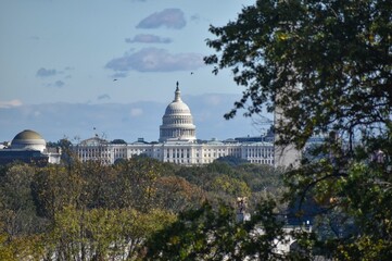 Washington, DC, USA - October 27, 2021: U.S. Capitol Building, Framed by Trees in the Foreground,...