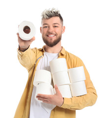 Young man with many rolls of toilet paper on white background