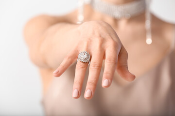 Female hand with beautiful ring on white background, closeup