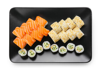 Plate with delicious sushi rolls on white background