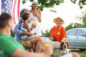 Happy family at picnic on summer day