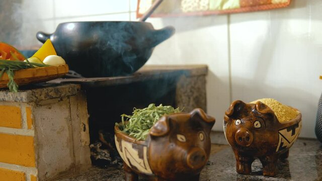 Cooking feijoada on a wood stove