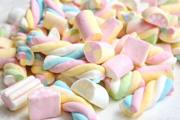 Tasty fluffy marshmallows on white background, closeup