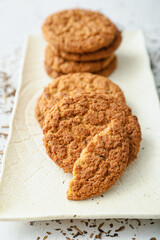 Plate with tasty hojicha cookies on white background