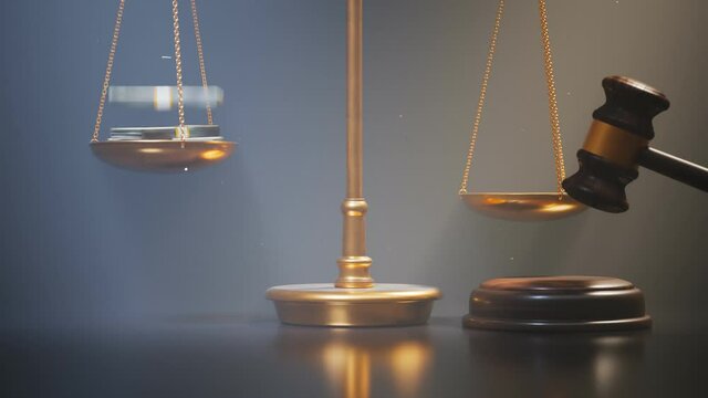 Footage with gold scales of justice and wooden gravel at the black background.