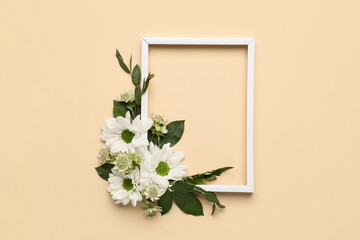 Composition with empty picture frame and flowers on color background