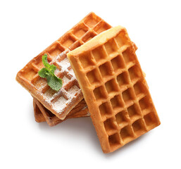 Tasty Belgian waffles with mint on white background