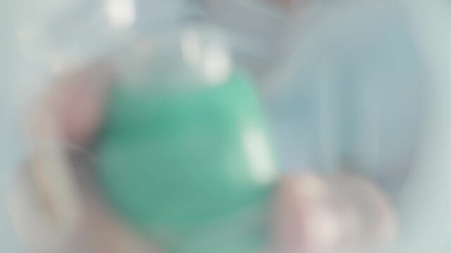 POV from eyes of Hospital patient, Doctor putting oxygen mask on - Blurred vision Concept