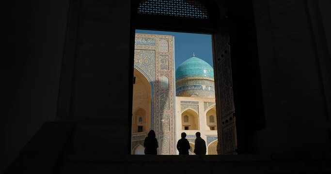 Bukhara city, Uzbekistan Kalyan Mosque from inside out. Gates of Kalyan mosque toward Miri Arab Madrassah.