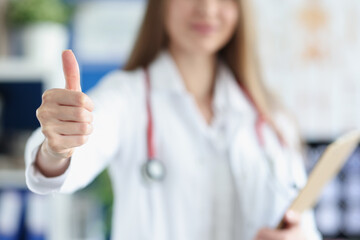 Doctor showing thumb up gesture