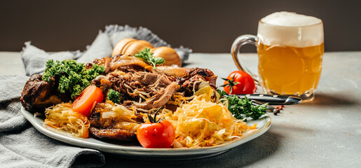 German cuisine, Roasted knuckle of pork with beer isolated on dark background, Bavarian grilled pork knuckle. Oktoberfest. banner, menu, recipe, place for text