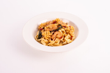 Contemporary Thai cuisine. Seafood spaghetti on white dish