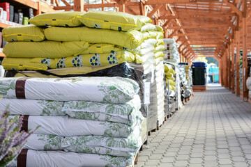 plastic bags with flower primer are in the supermarket warehouse. storage for products