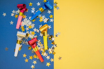 Colorful celebration pattern with party blower horns. Minimal party concept. Flat lay.Whistle...