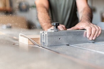 Person cutting a step diagonally on sliding table