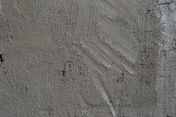 The texture of gray concrete made of cement in close - up is a good background or texture for the design