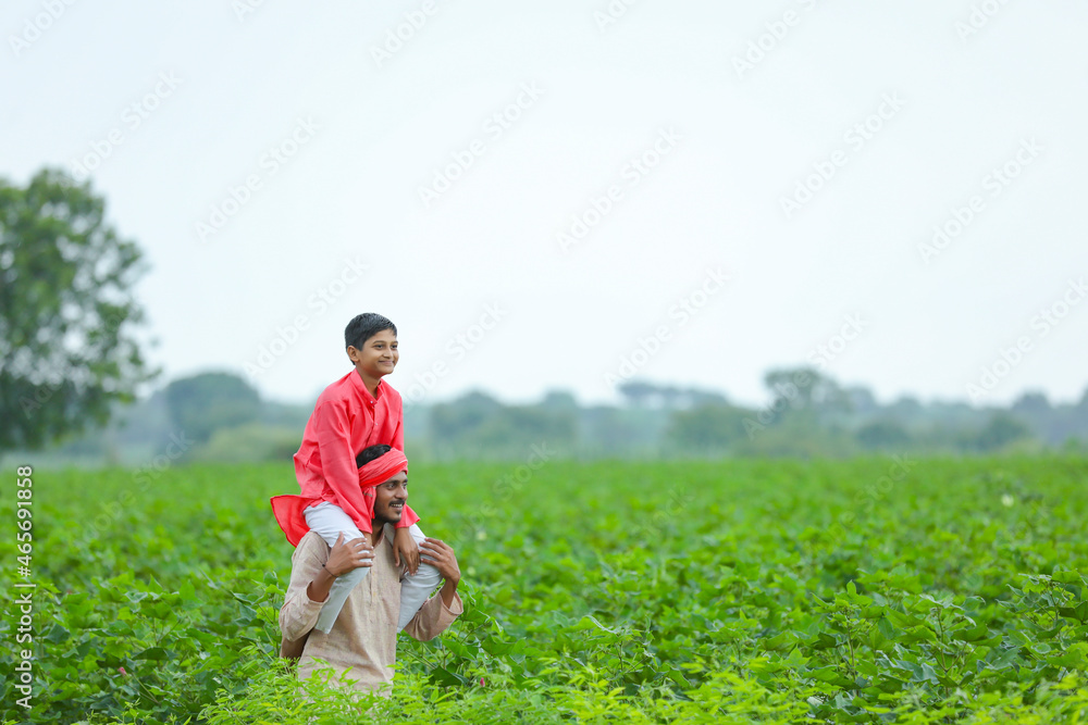 Wall mural Indian farmer with his son at agriculture field