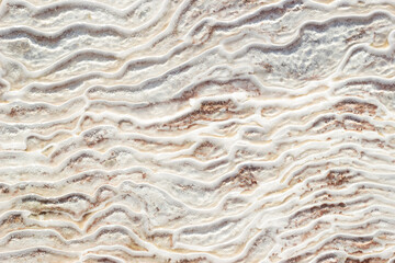 Background textural of asymmetric drawing. Natural texture of travertine Pamukkale. Close-up