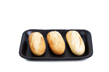 Three rolls isolated on black tray on white background