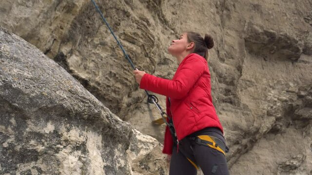 Outdoors rock climbing training and partner insurance. Climbing extreme active sport activity.