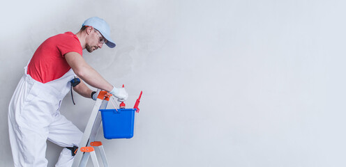 Interior Painter Contractor Worker on a Ladder © Tomasz Zajda