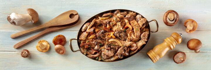 Beef stroganoff panorama. Mushroom and meat ragout with cream sauce, in a pan with ingredients, overhead flat lay shot on a rustic wooden background - obrazy, fototapety, plakaty
