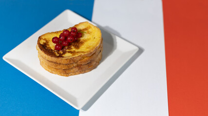 Traditional French toast with figs and red currants. Fried bread soaked in a mixture of milk, eggs and sugar.