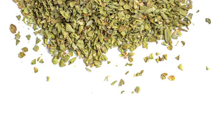 Dried oregano spice isolated on white background. Pile of dry  oregano or marjoram leaves top view.