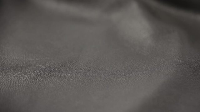 Slide shot man touching fine leather closeup