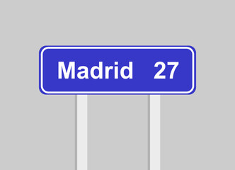 Traffic sign indicating the remaining distance to reach the city of Madrid. Traffic sign in blue with white letters.