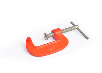 An image isolated select focus steel clamp-c or vise tool is screw hold for carpenter build and adjusting on white background.