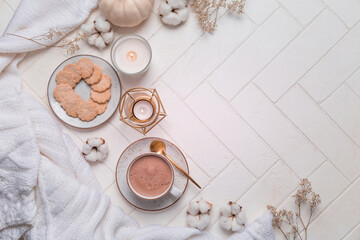 Fototapeta na wymiar Autumn and winter still life with hot chocolate and cocoa, cookies, candles