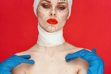portrait of a woman Red lips plastic surgery operation bare shoulders red background