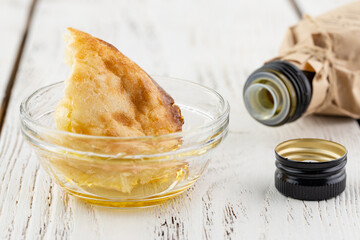 Close up olive oil bottle on table