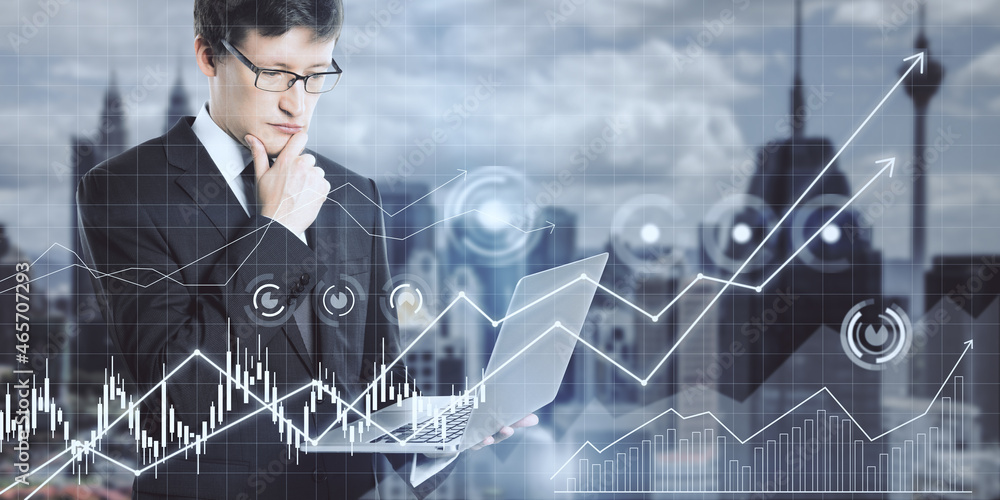 Aufkleber attractive young european businessman using laptop computer with glowing business chart grid on blur