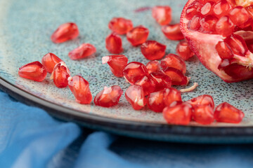 Composition with ripe pomegranates on blue table