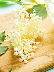 Elderberry flowers on wood