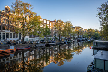Fototapeta na wymiar Amsterdam sunset city skyline at canal waterfront.