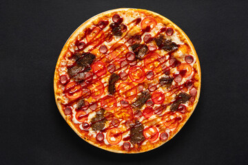 tasty pizza on the black background