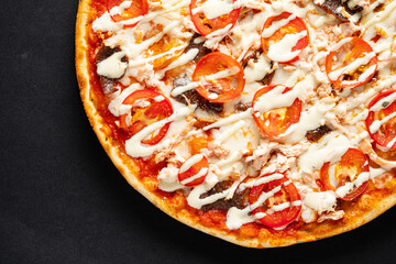 tasty pizza on the black background