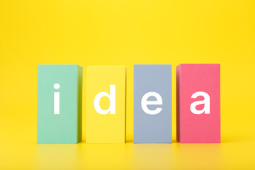 Creativity, innovation and idea concept. Single word idea written on multicolored rectangles on...