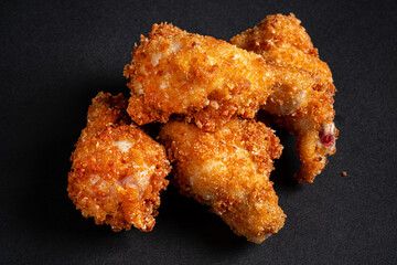 fried chicken on the black background