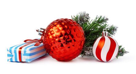 Christmas baubles and festive gift box isolated on white background