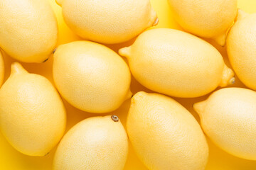 Several yellow bright lemons. Bright citruses.