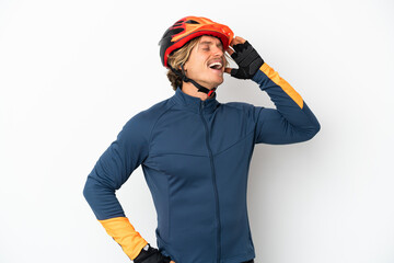 Young blonde cyclist man isolated on white background smiling a lot - obrazy, fototapety, plakaty