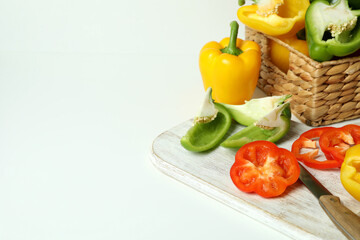 Concept of tasty food with bell pepper on white background