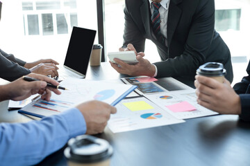 Meeting business team leaders about charts, financial graphs showing results are analyzing and calculating planning strategies, business success building processes